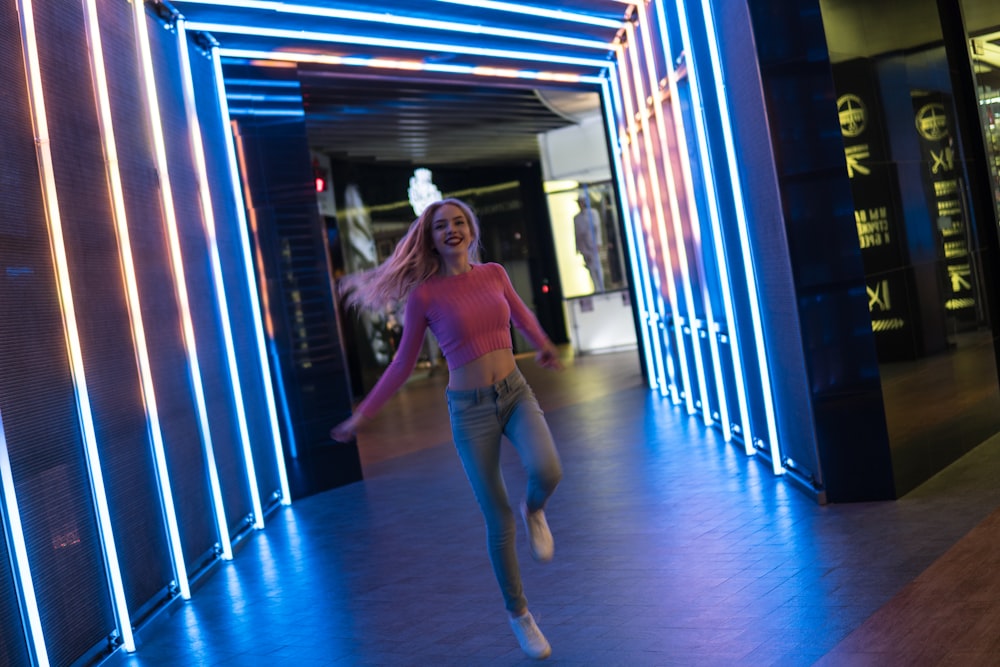 woman standing near lighted wall