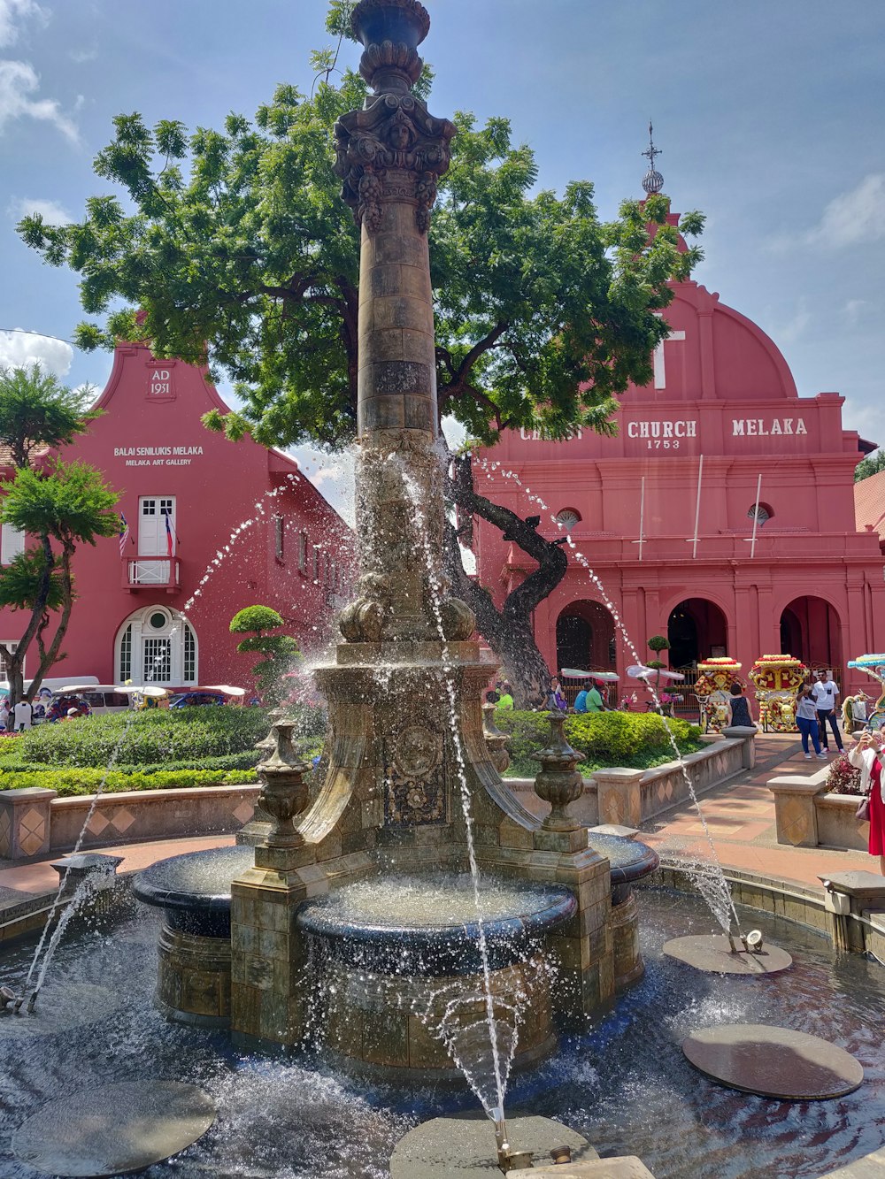 water fountain near tree