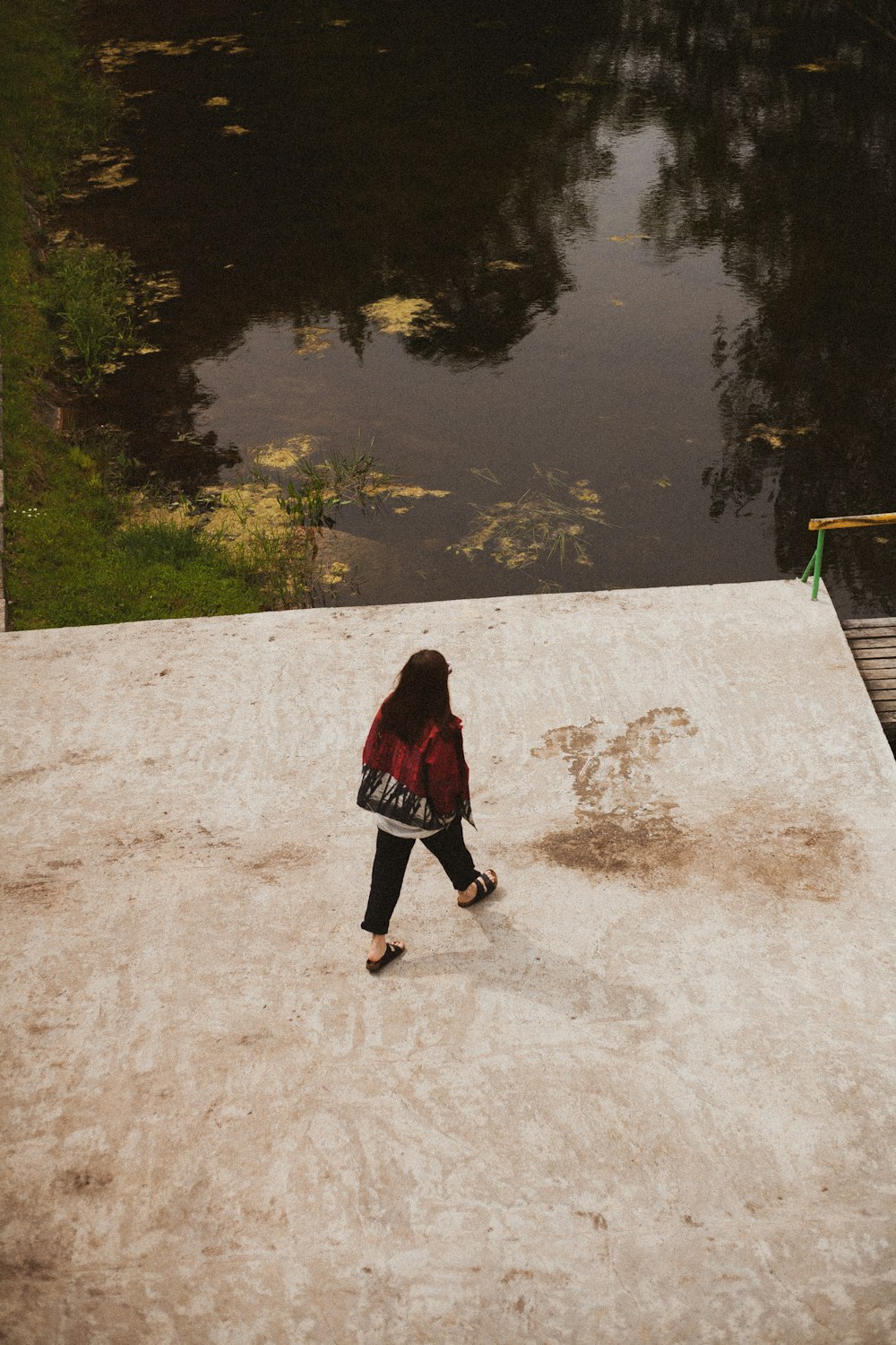 woman standing near river