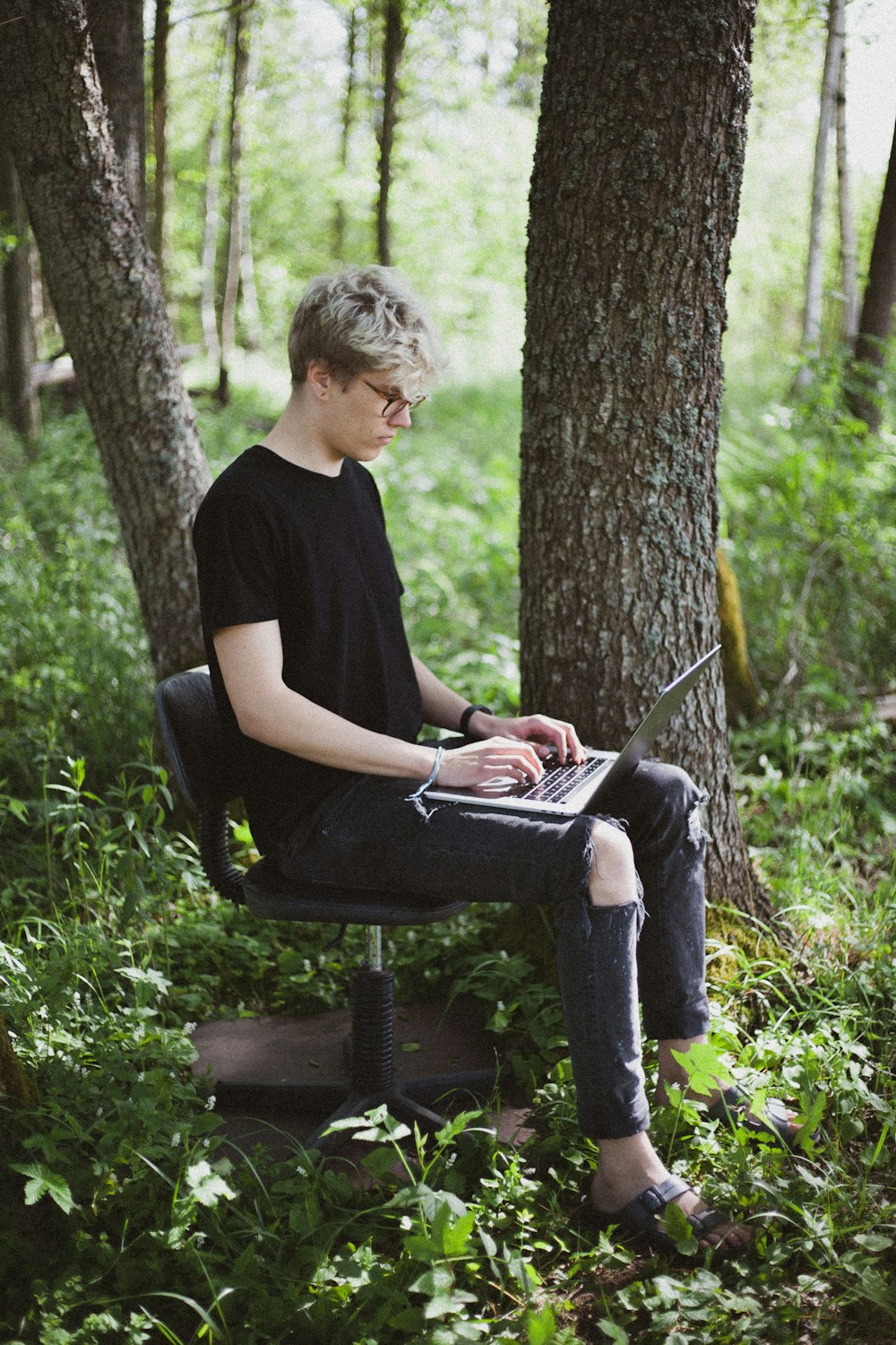 man sitting on black chair