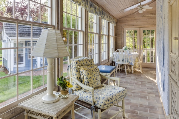 hallway with wooden chairs, floral seats, and vintage lamp - granny chic - grandma style - Fall 2023 decor trends