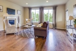 a living room filled with furniture and a fire place