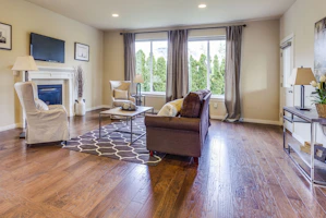 a living room filled with furniture and a fire place