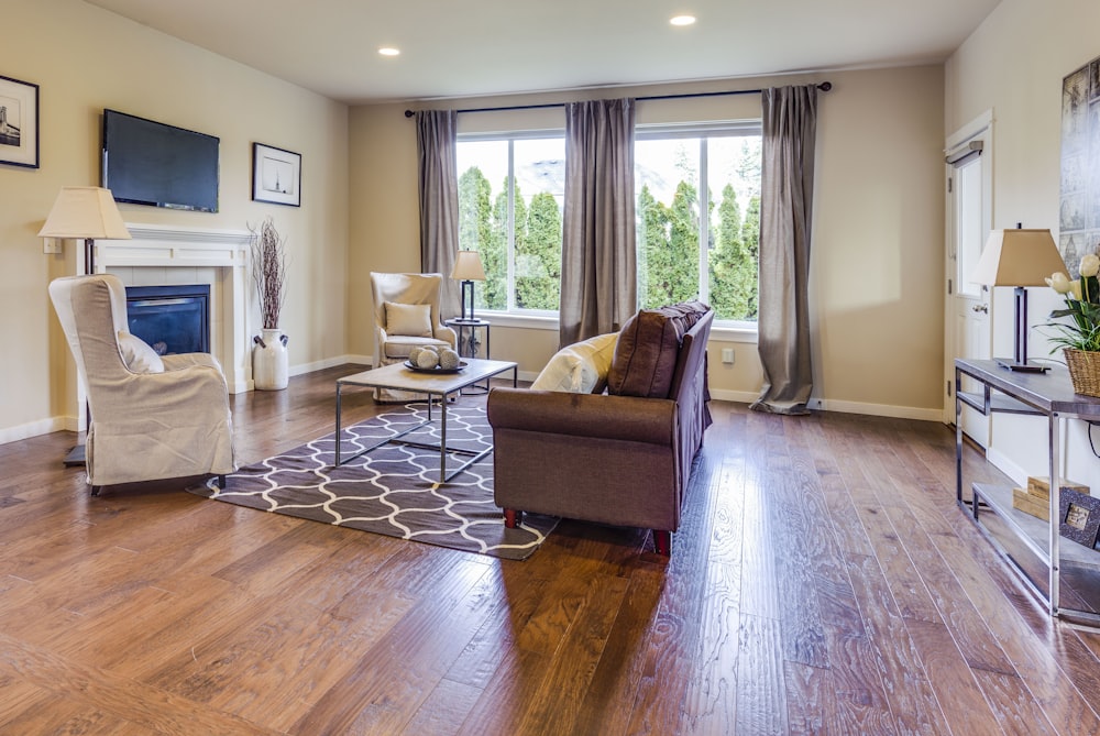 a living room filled with furniture and a fire place