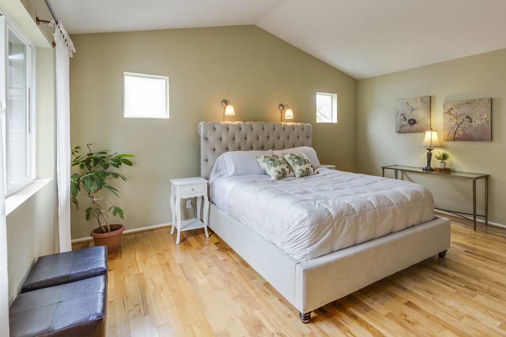 tufted white upholstered bed