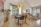 brown-and-black wooden 5-piece dining set