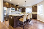 brown kitchen cabinet with kitchen island