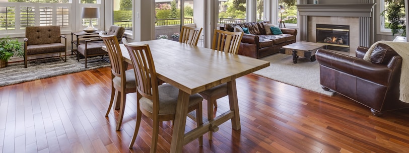 rectangular brown wooden table and chair set