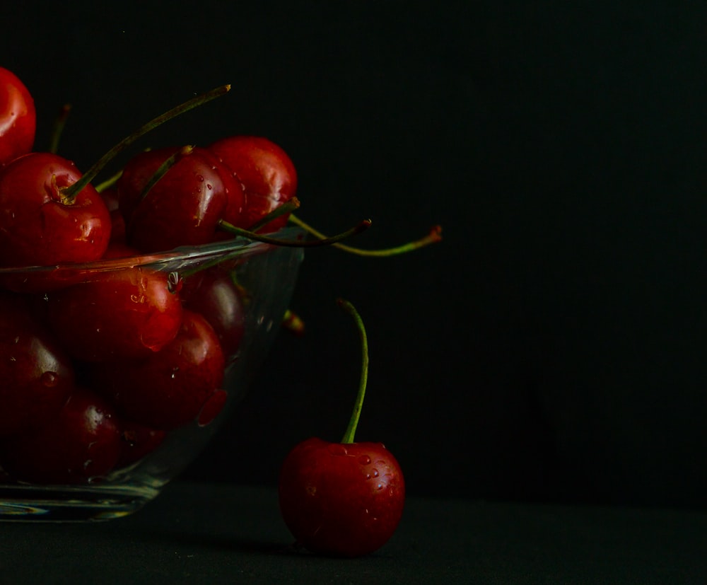 a bowl of red cherries