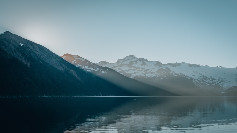 mountains near body of water