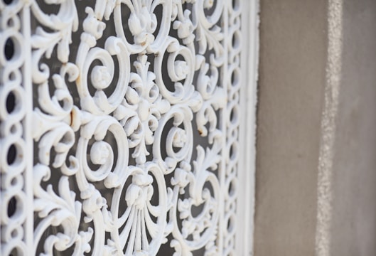 Close-up of a sleek invisible grill installed on a balcony in Egmore, showing minimal obstruction.