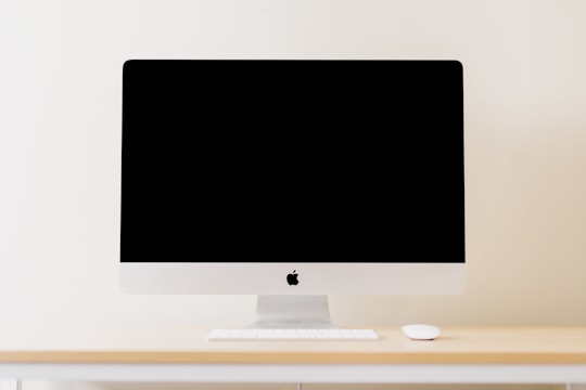 A minimalist workspace with a blank computer screen.