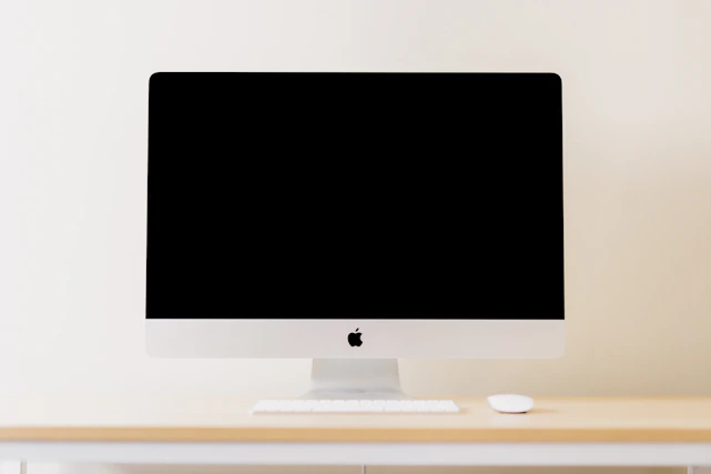 Minimalist workspace with sleek tech gadgets and a clean white background.