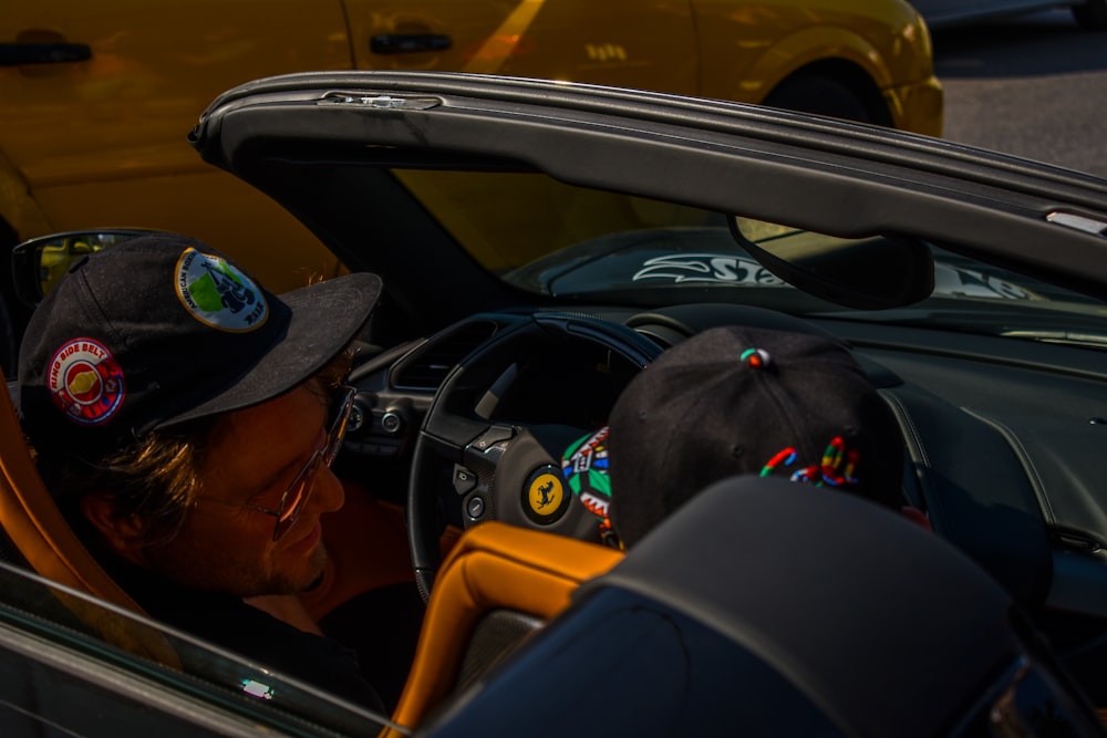 man riding on black Ferrari vehicle