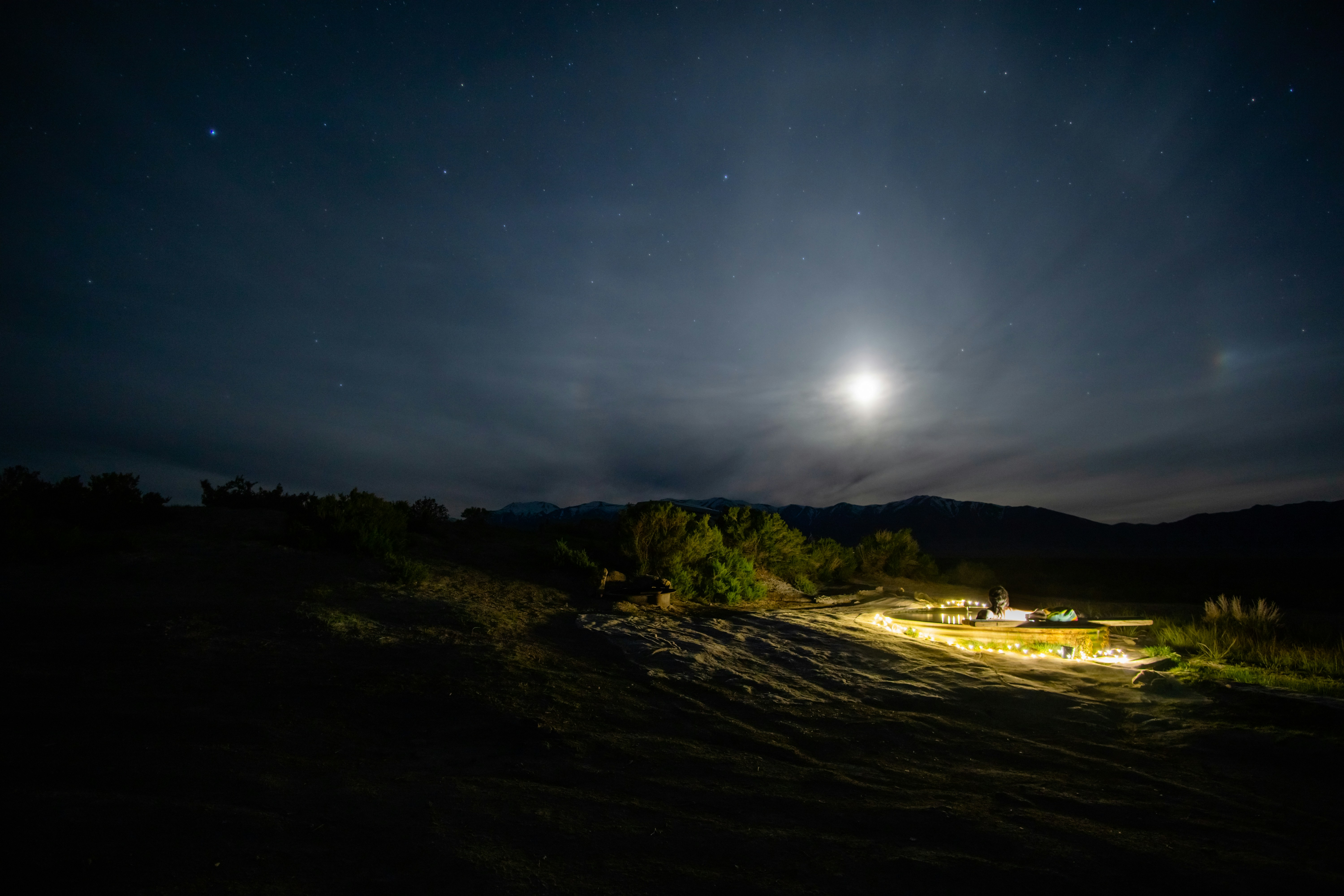 silhouette mountain during night time