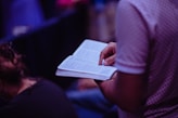 person sitting and reading book