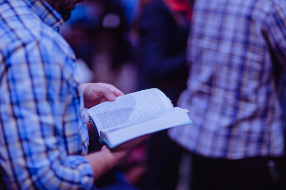 person holding book