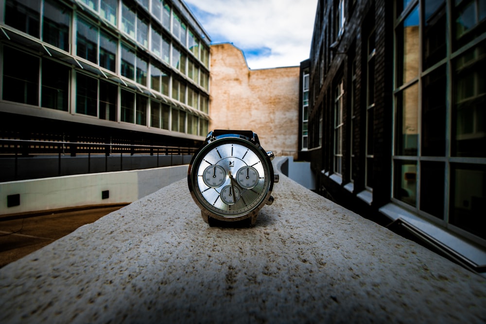 round silver-colored chronograph watch