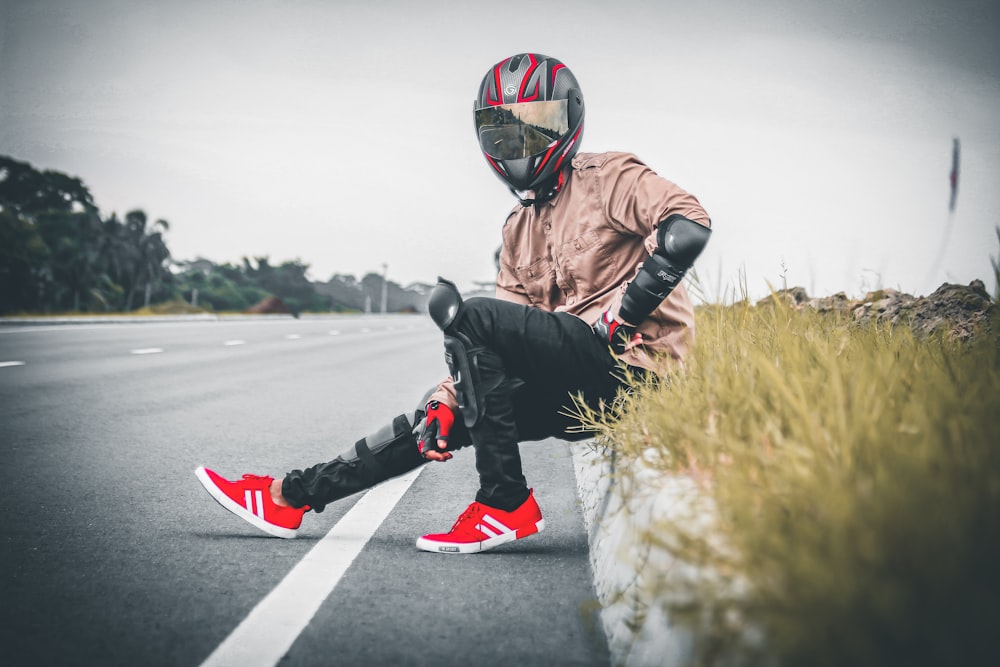 person wearing riding gear beside road