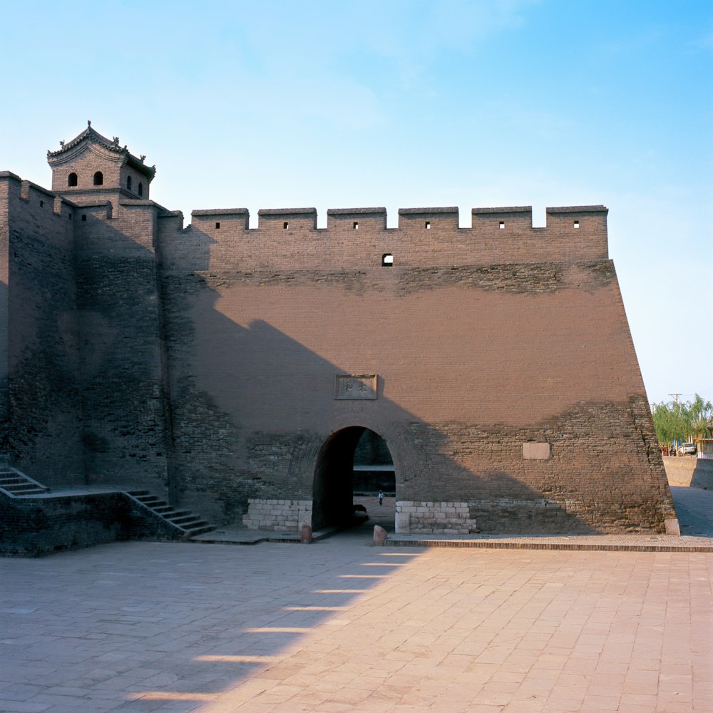 brown concrete castle under blue sky