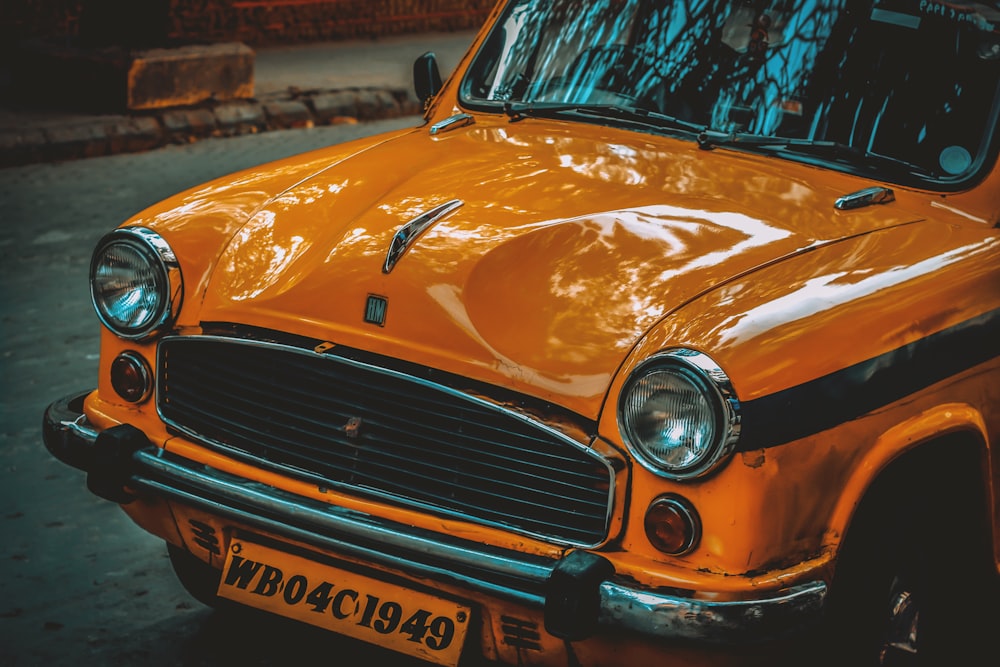 a yellow car parked on the side of the road