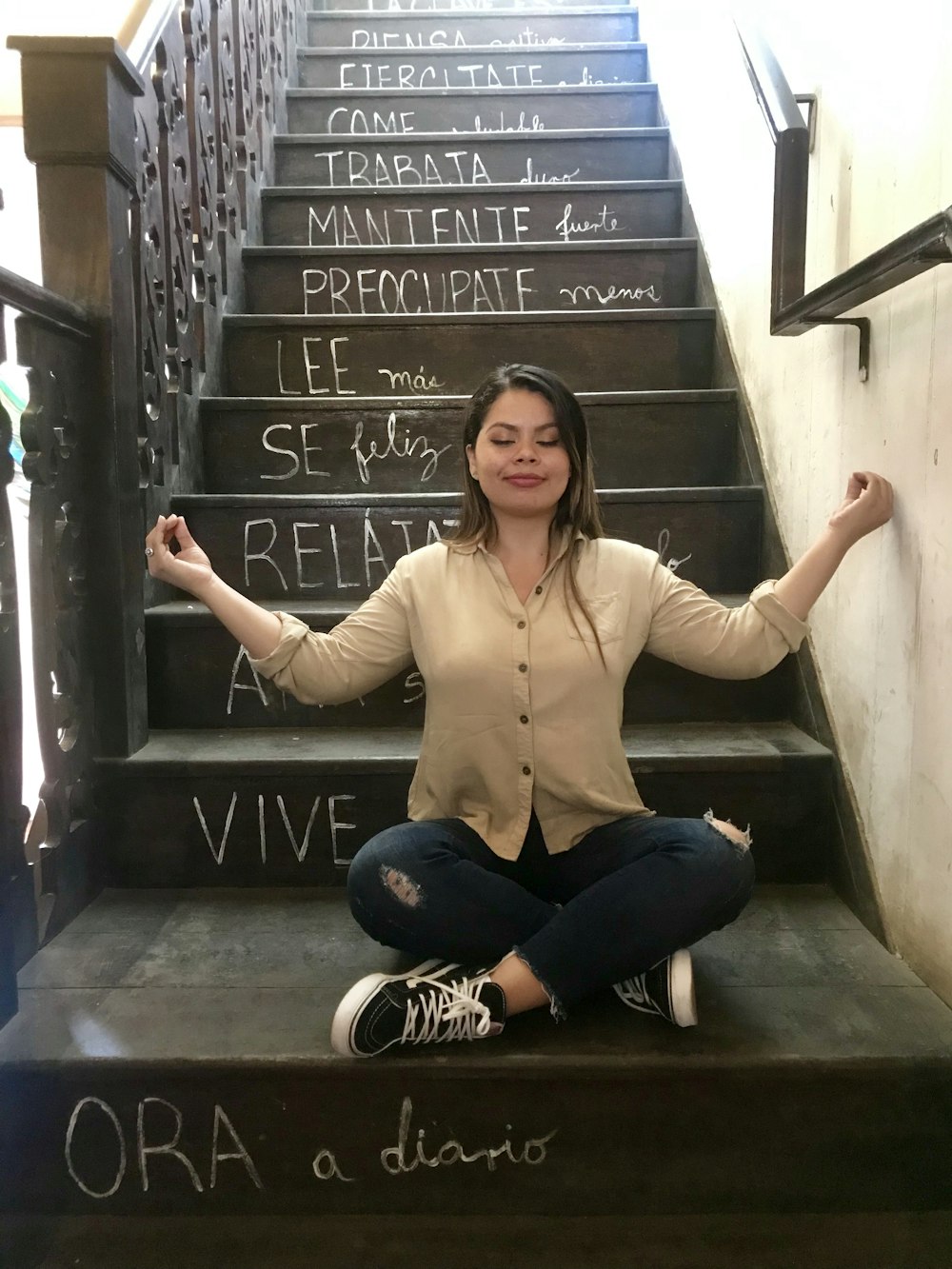 woman sitting on stair