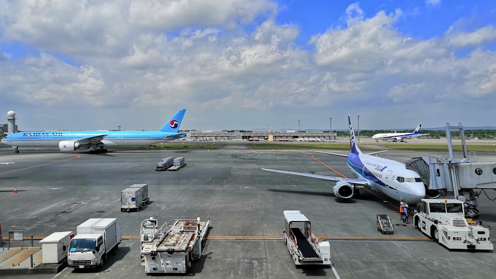 white and blue airplane at daytime