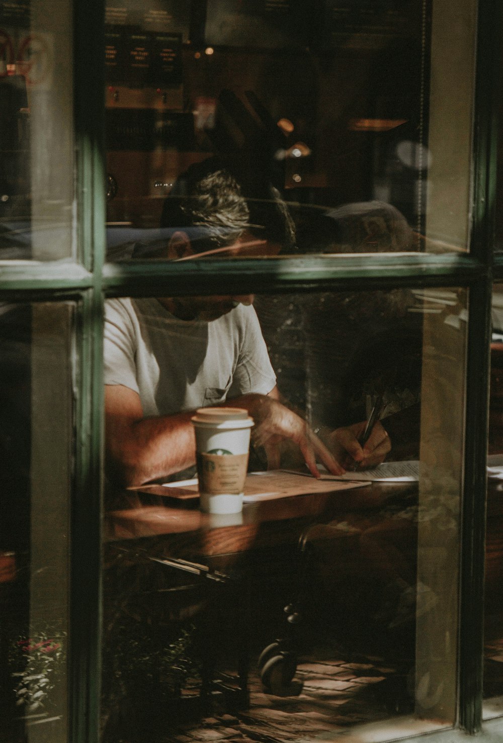 man wearing white crew-neck t-shirt