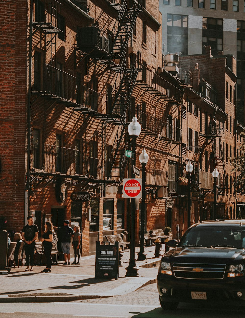 person standing on brown building