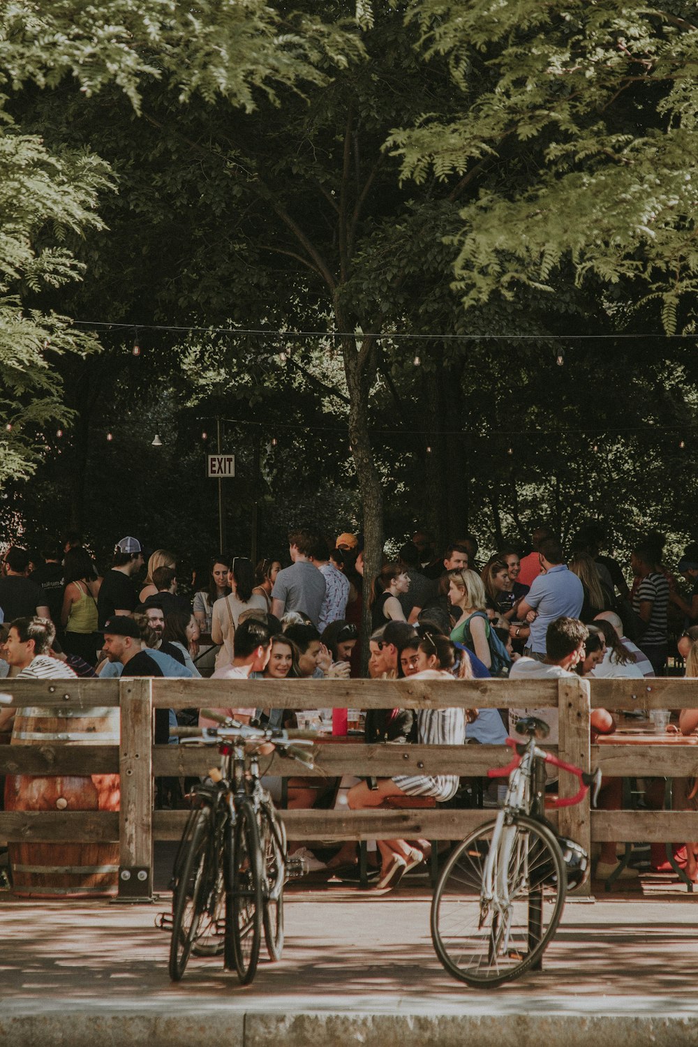 people standing and sitting outside during daytime