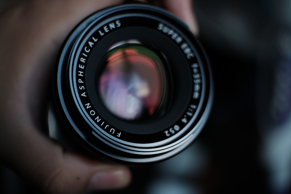 selective focus photo of white and black camera lens