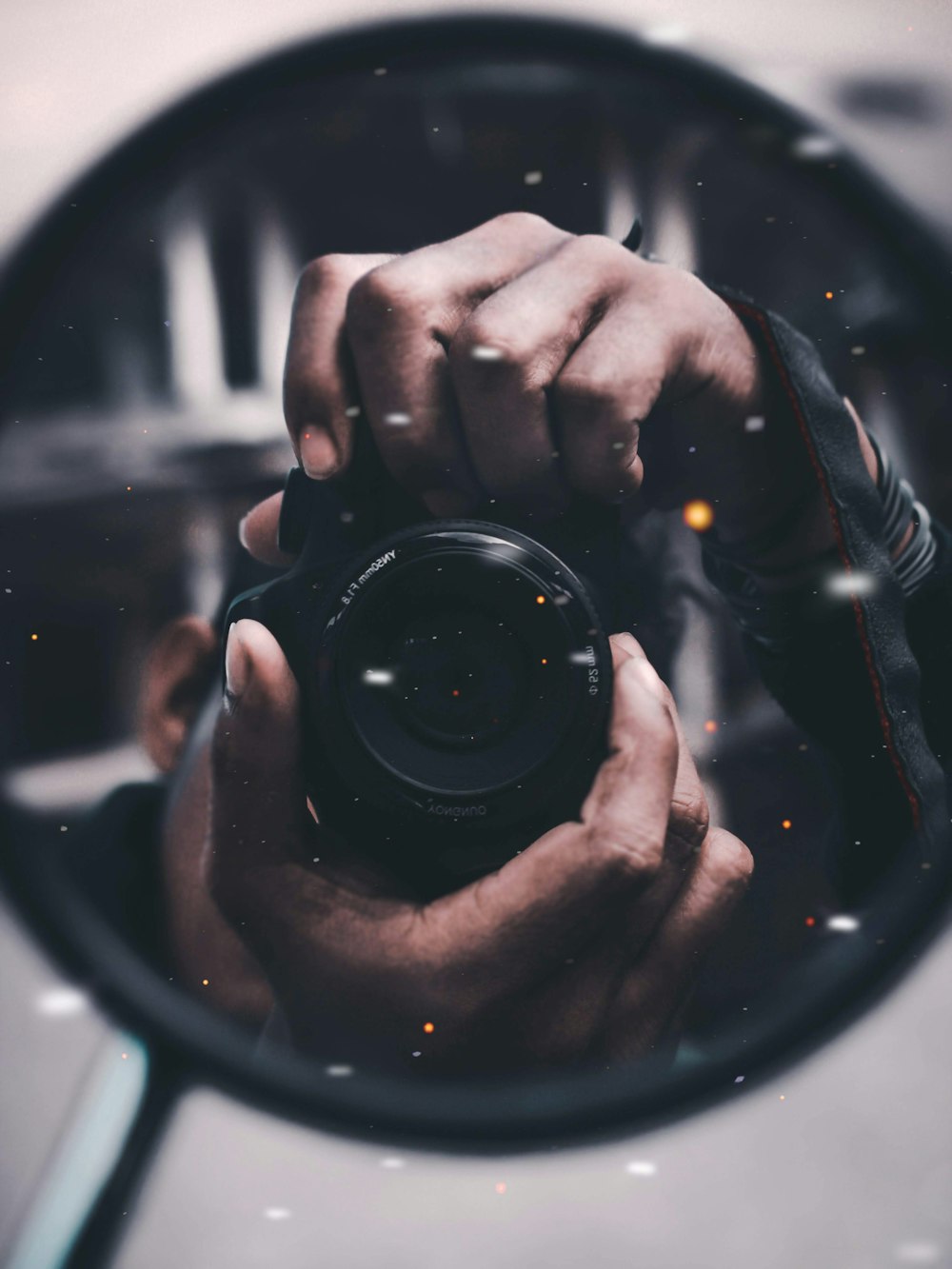 person holding black DSLR camera