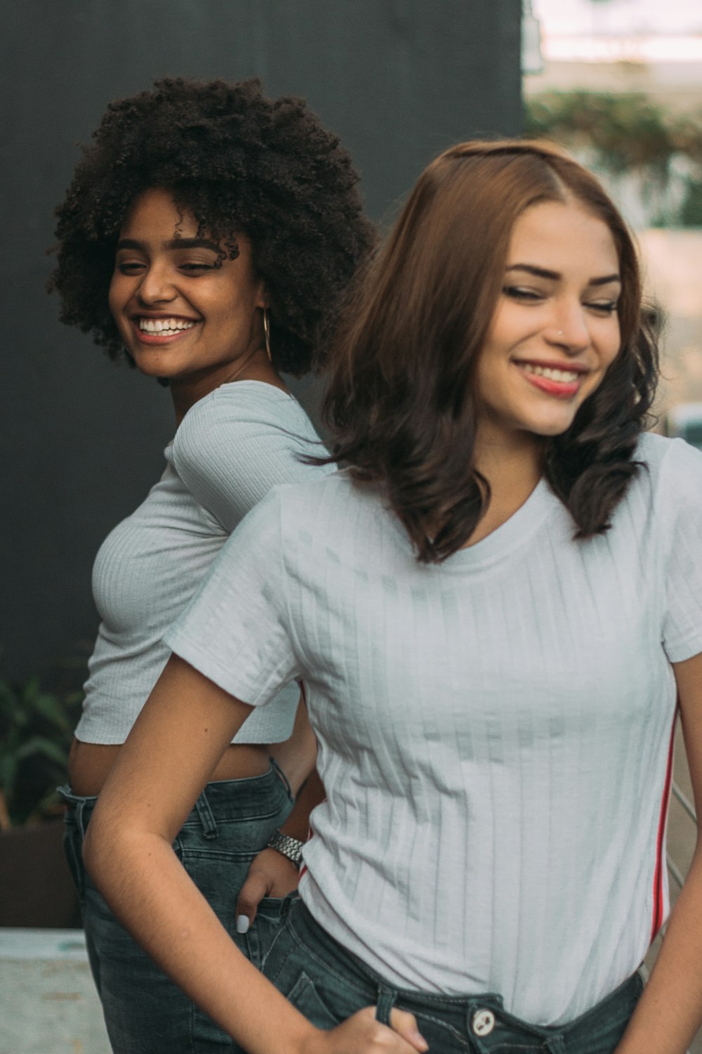 two women wearing white shirts