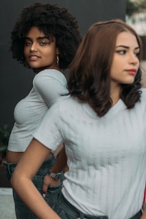 two woman on focus photography