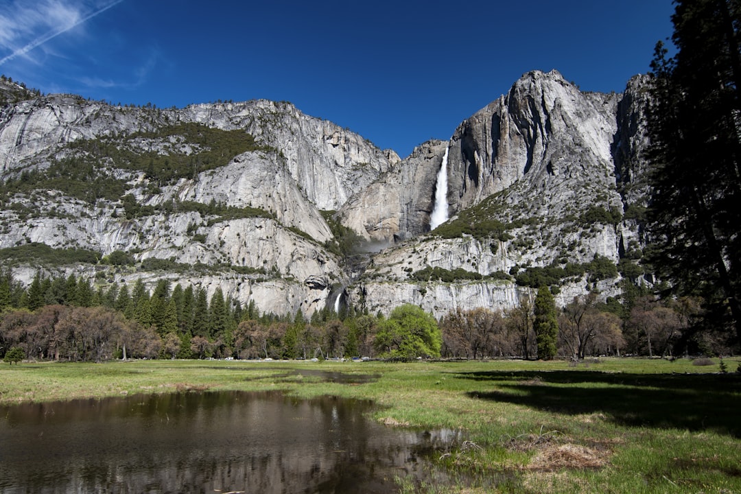 gray mountain under blue sky,