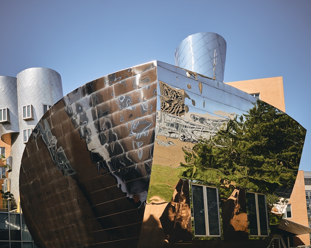 mirrored building photo during daytime