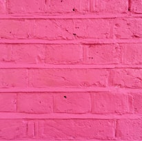 A close-up of freshly painted walls in a vibrant color, highlighting the attention to detail in interior painting.
