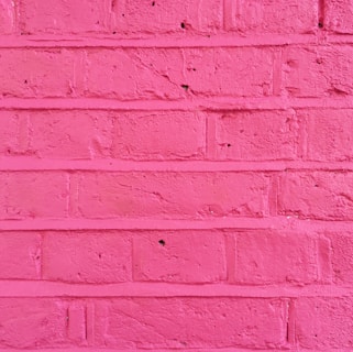 A close-up of a freshly painted wall in a vibrant color.