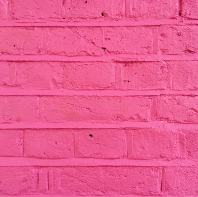 Close-up of a freshly painted wall with smooth, vibrant colors showcasing attention to detail and quality finishes.
