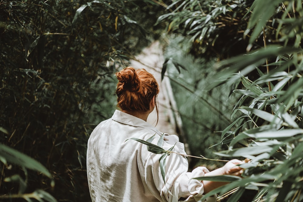 woman standing near grass