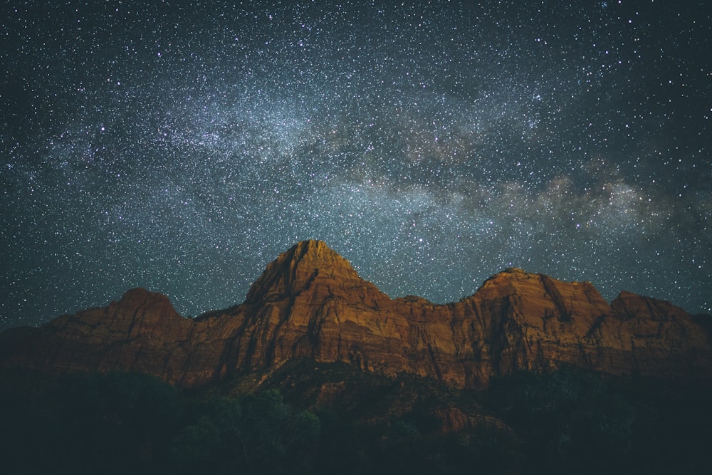 landscape photo of mountain under starry night