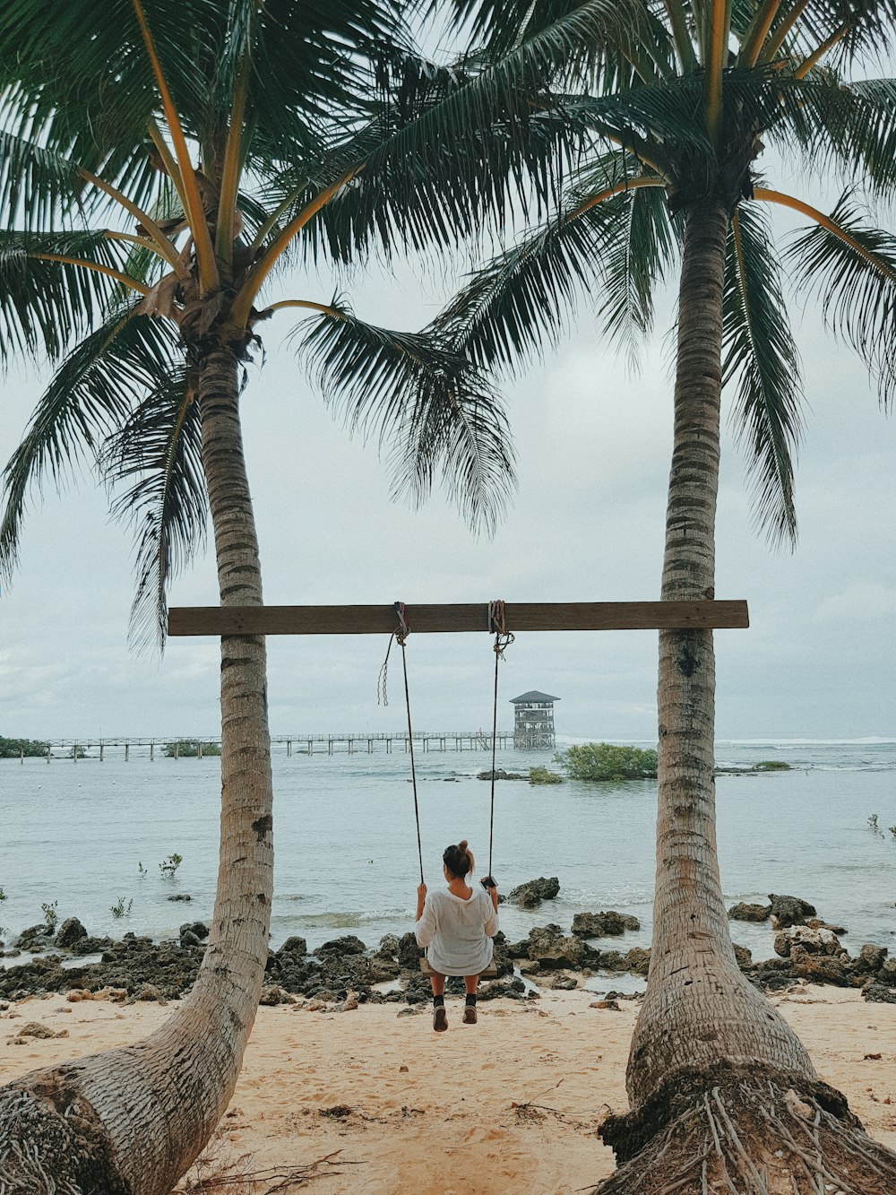 unknown person sitting on swing