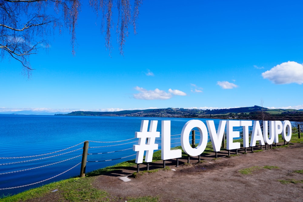 Lovetaupo freestanding letter beside sea