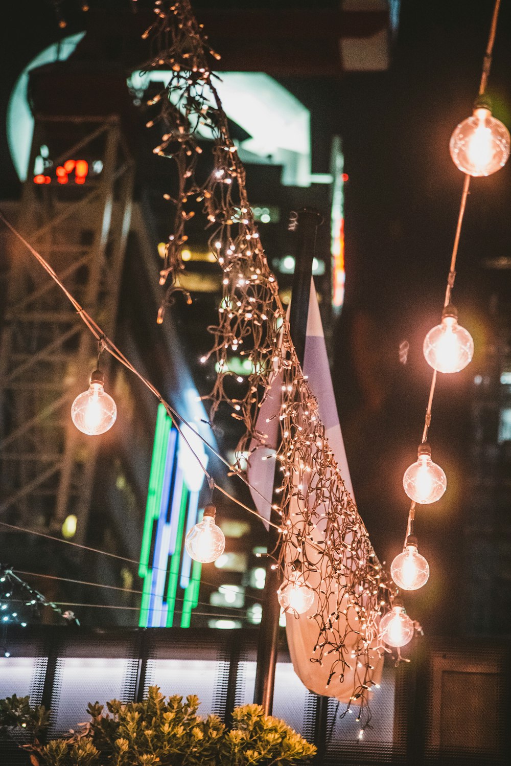 a bunch of lights that are hanging from a pole