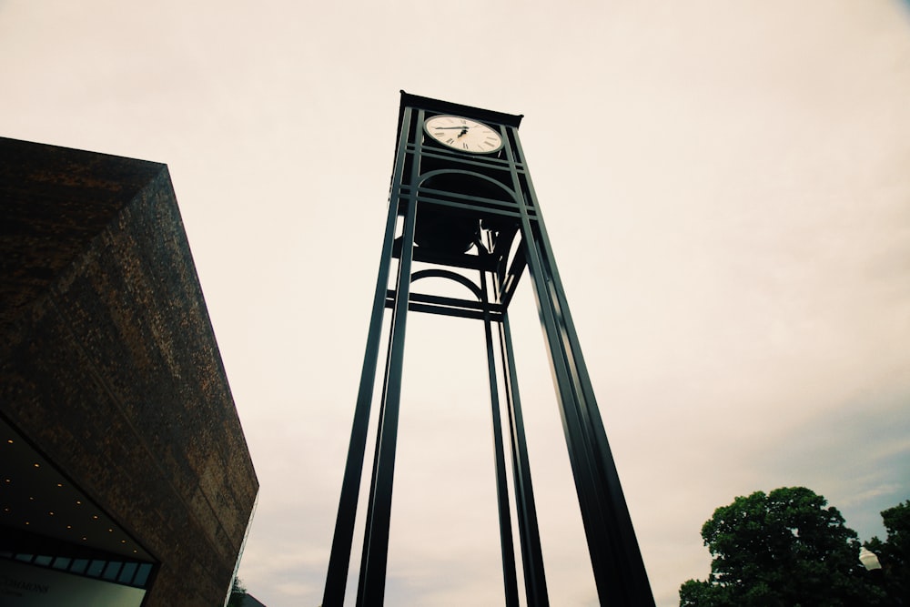 close-up photography of clock tower during daytime