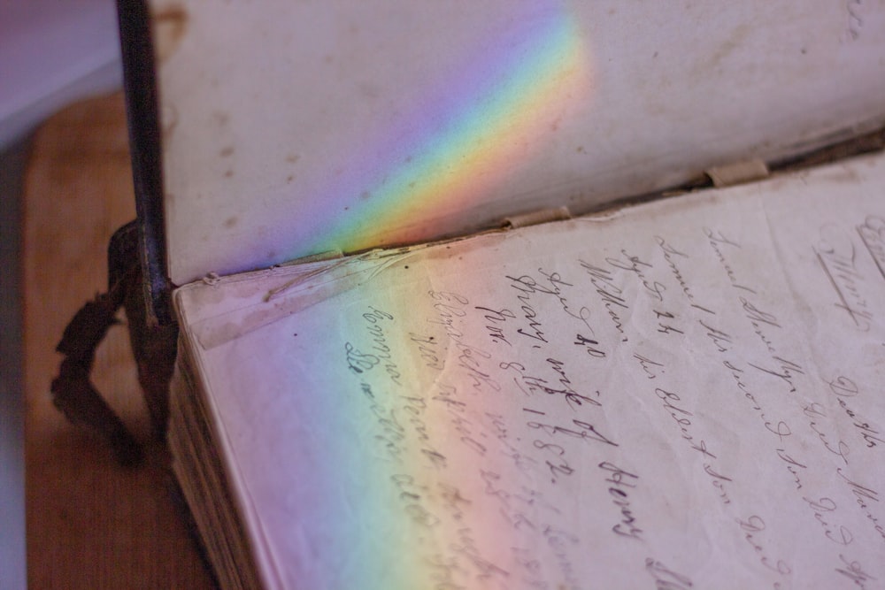a book with a rainbow in the middle of it