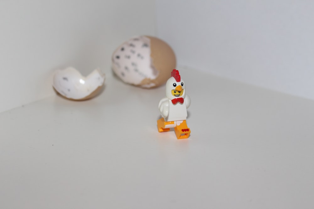 white and red chick toy