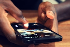 close-up photography of person using smartphone