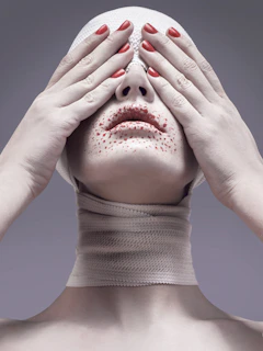 woman covering her eyes