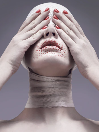 woman covering her eyes